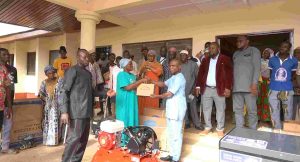 A beneficiary recieving Electric Sewing Machine