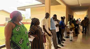 nurses an teachers in a cue waiting for screening